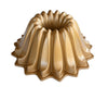 Moule à Bundt en forme de tulband Nordic Ware Lotus Bundt, couleur or, ø 21 / 1,2 litre.